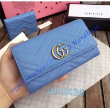 Gucci GG Marmont continental wallet in Blue leather with a chevron design Gucci GG Marmont continental wallet in Blue leather with a chevron design